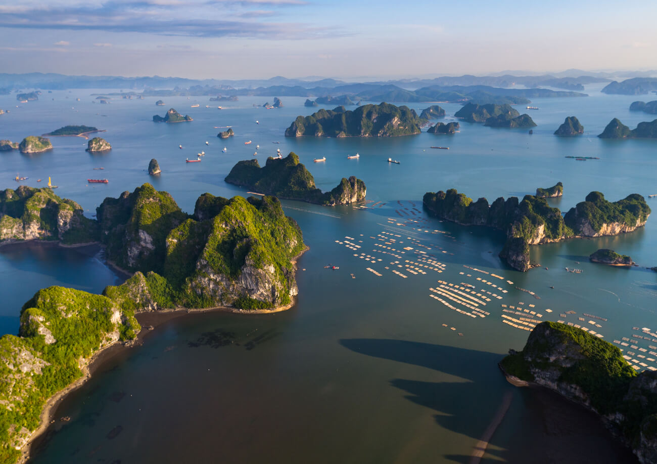 scenic-view-rock-formations-bay-against-sky-sunset
